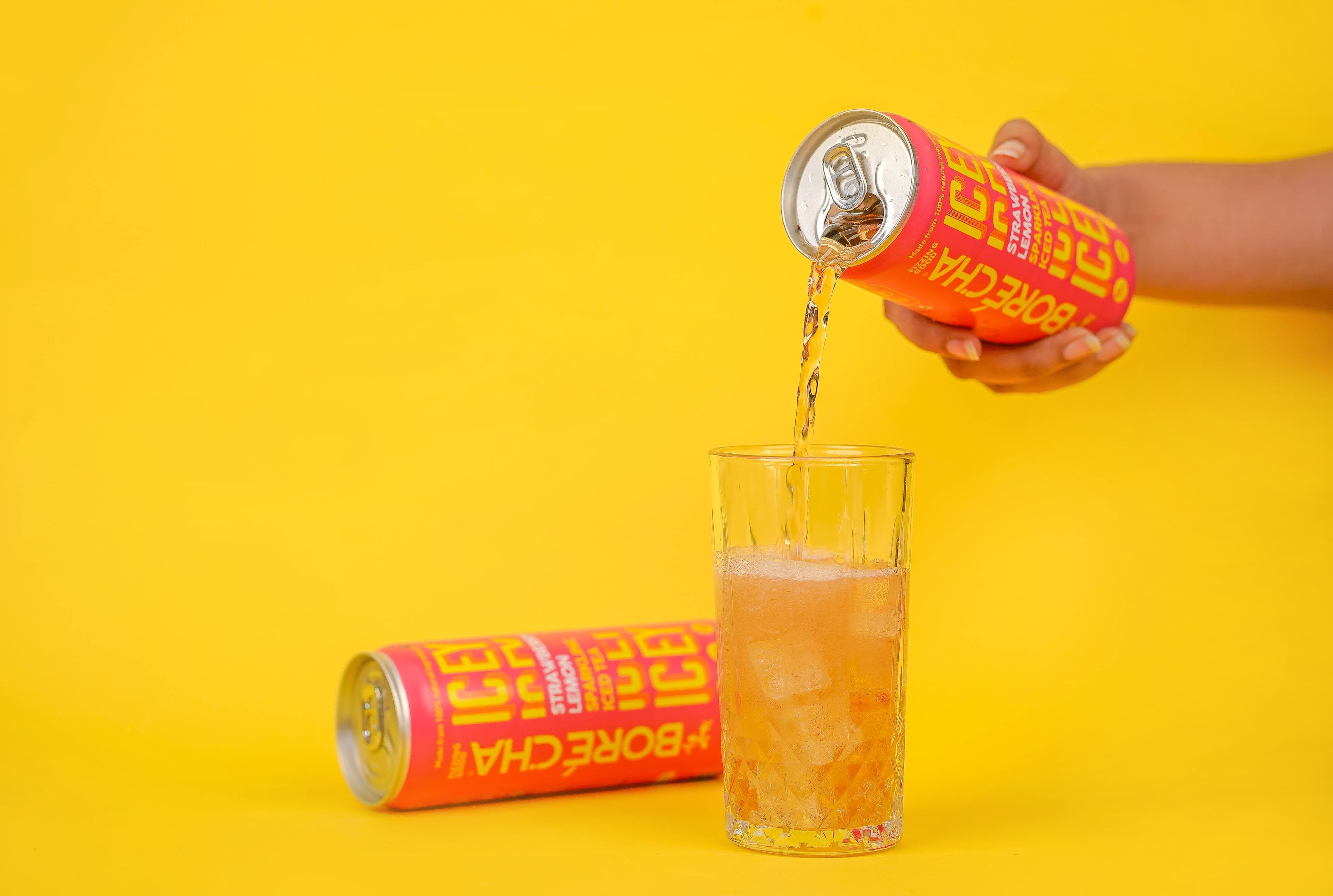 Strawberry Lemon sparkling iced tea being poured over ice